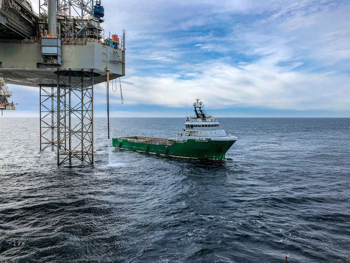 Offshore supply vessel alongside a jack-up platform